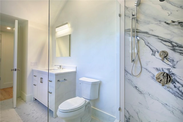 bathroom with vanity, a shower with shower door, and toilet