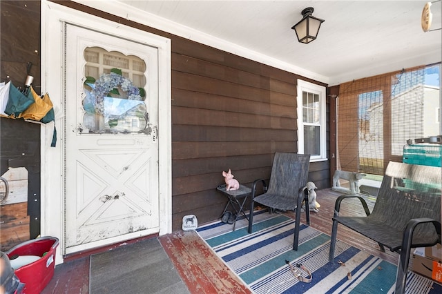 entrance to property featuring a porch