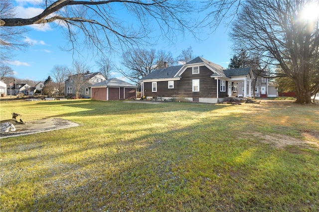 view of side of property with a yard