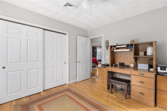 office featuring ceiling fan and light hardwood / wood-style floors