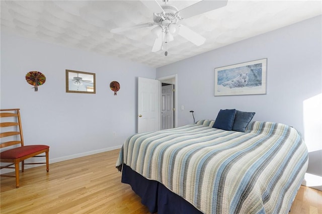 bedroom featuring ceiling fan and light wood-type flooring