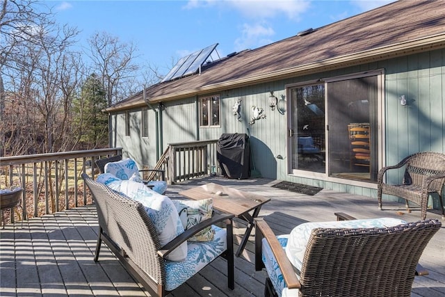 wooden terrace featuring a grill