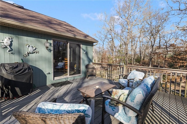 wooden deck featuring outdoor lounge area and area for grilling