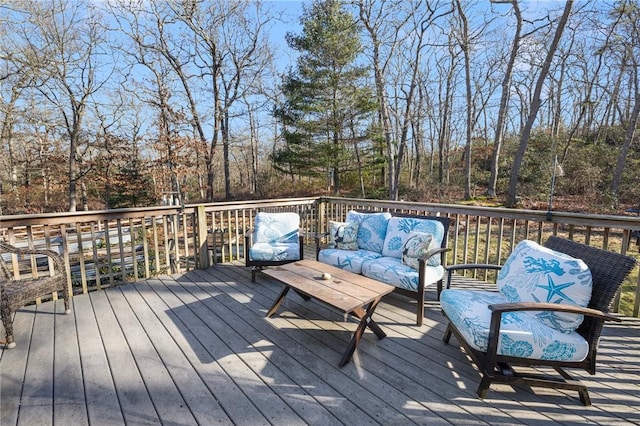 wooden terrace featuring an outdoor living space