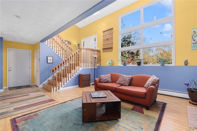 living room with hardwood / wood-style flooring and a baseboard radiator