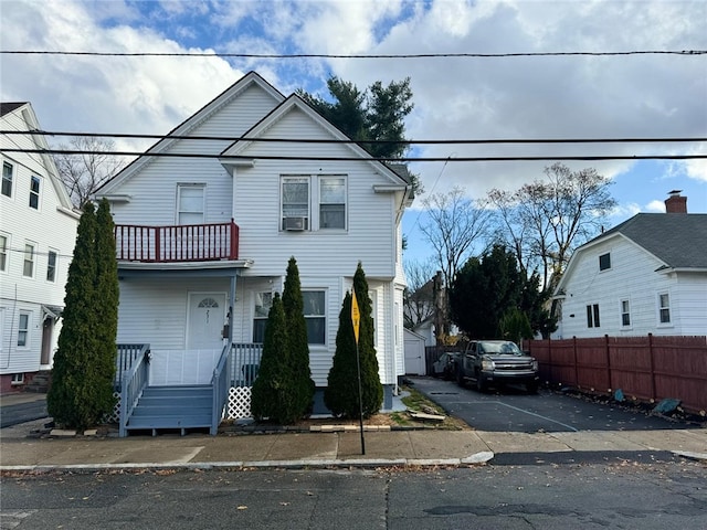 front facade with a balcony and cooling unit