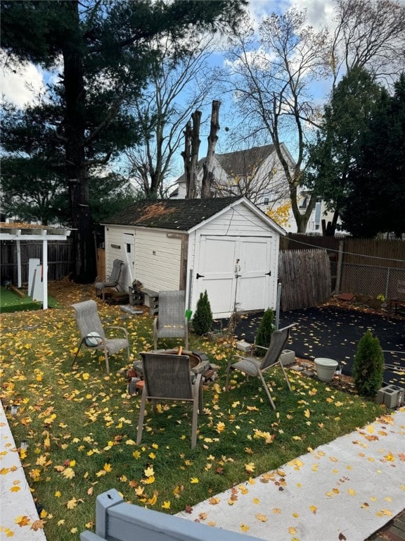 view of yard with an outdoor fire pit