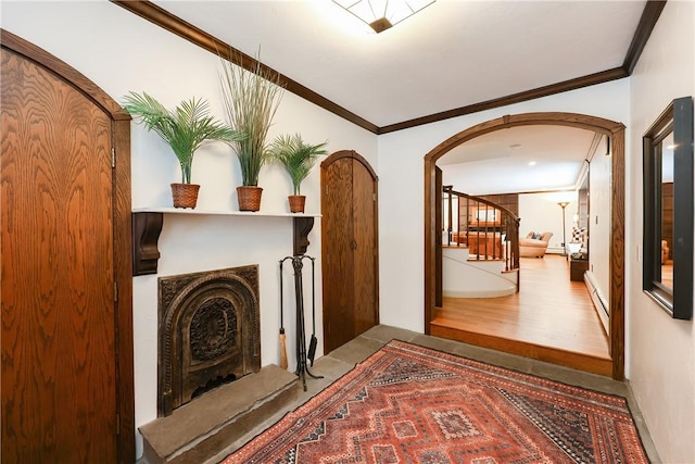 hall featuring ornamental molding and a baseboard radiator