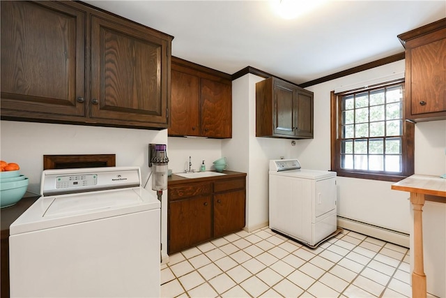 laundry room featuring baseboard heating, separate washer and dryer, cabinets, crown molding, and sink