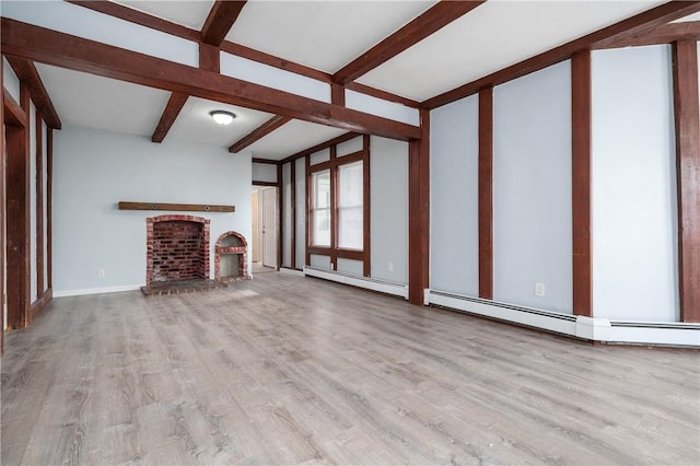 unfurnished living room featuring beam ceiling, light hardwood / wood-style floors, baseboard heating, and a brick fireplace