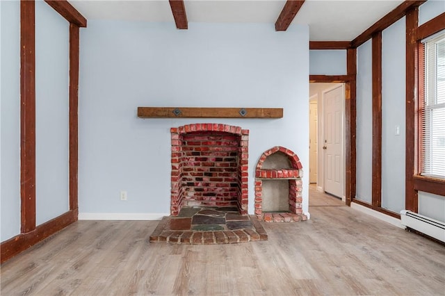 unfurnished living room with light hardwood / wood-style floors and a baseboard radiator