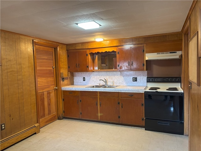 kitchen featuring white electric range, sink, and a baseboard radiator