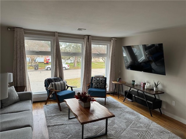 living room with light hardwood / wood-style flooring