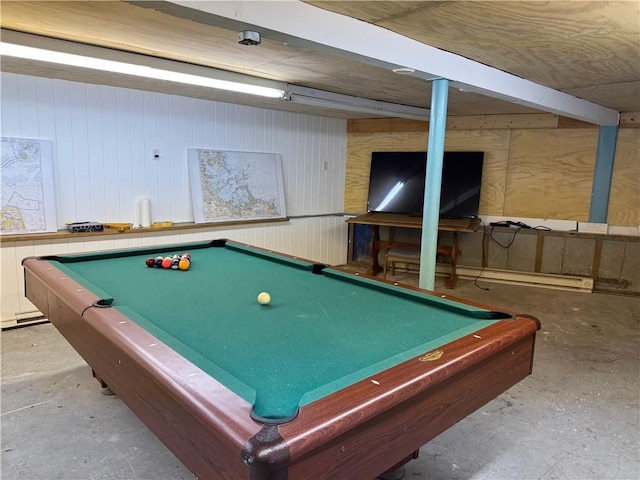 recreation room featuring billiards, concrete floors, and wood walls