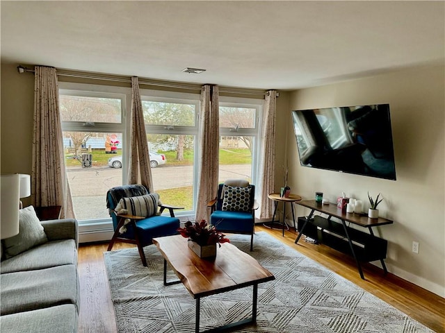 living room with light hardwood / wood-style flooring