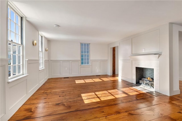 unfurnished living room with light wood-type flooring