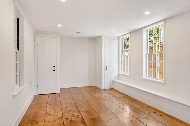 empty room with light wood-type flooring