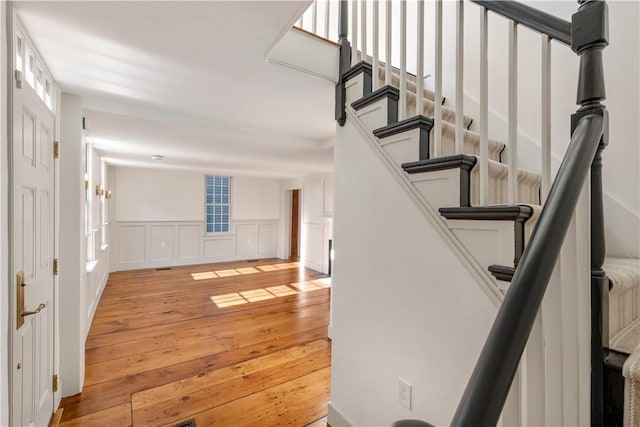 stairway featuring wood-type flooring