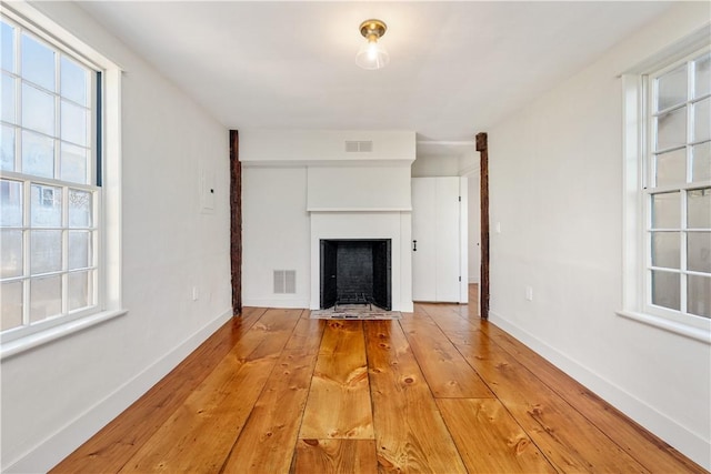 unfurnished living room featuring light hardwood / wood-style flooring