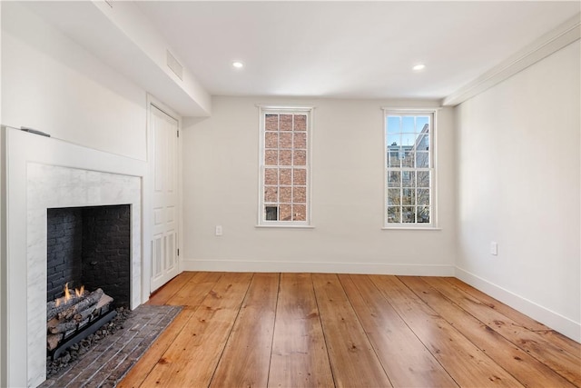 living room with hardwood / wood-style floors and ornamental molding