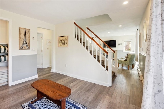 stairs with wood-type flooring