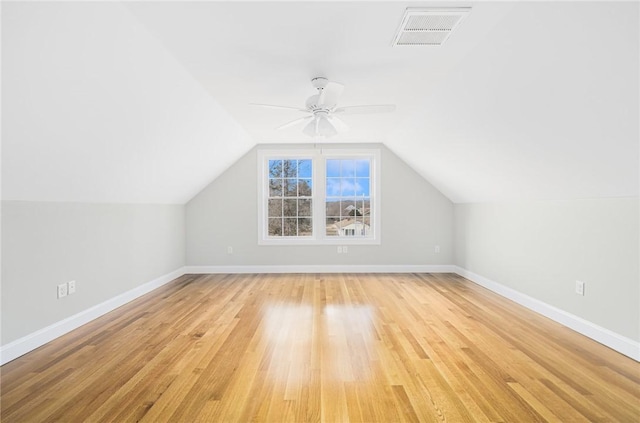 bonus room with ceiling fan, light wood-type flooring, and vaulted ceiling