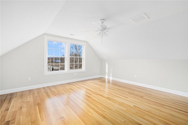 bonus room featuring lofted ceiling, ceiling fan, and light wood-type flooring