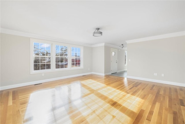 interior space featuring light hardwood / wood-style flooring and ornamental molding