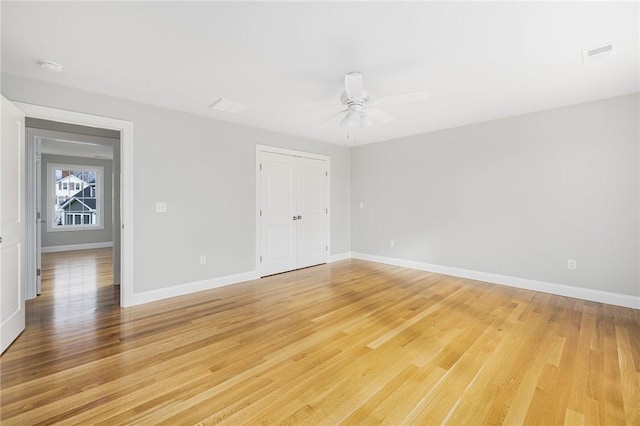 spare room with light hardwood / wood-style flooring and ceiling fan