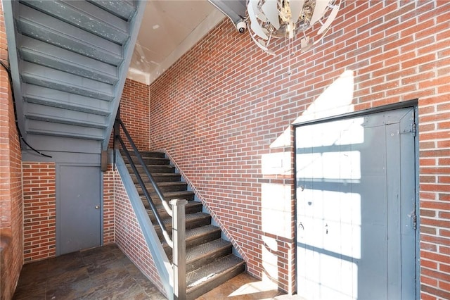 stairway with brick wall