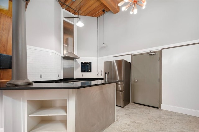 kitchen with stainless steel refrigerator with ice dispenser, tasteful backsplash, wall chimney exhaust hood, wood ceiling, and pendant lighting