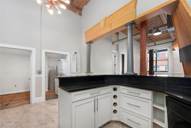 kitchen with white cabinets, beverage cooler, ornate columns, kitchen peninsula, and wood ceiling