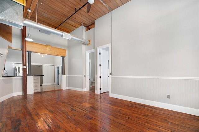 unfurnished room with hardwood / wood-style flooring, ceiling fan, and wood ceiling