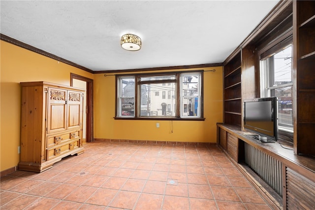 interior space featuring light tile patterned floors and ornamental molding