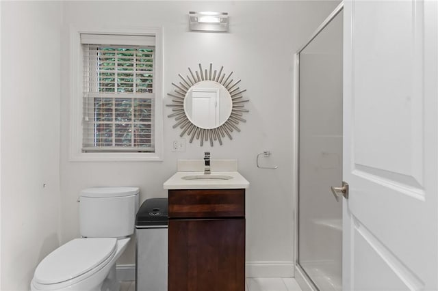 bathroom with tile patterned flooring, vanity, toilet, and an enclosed shower