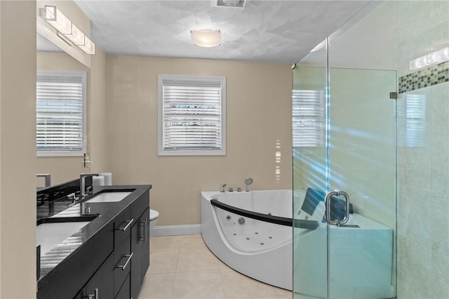 full bathroom featuring tile patterned floors, vanity, shower with separate bathtub, and a wealth of natural light