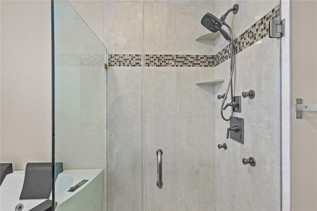 bathroom featuring independent shower and bath