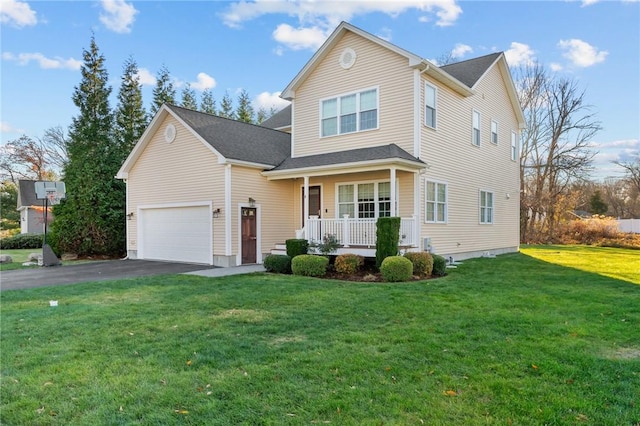 front of property with a porch, a garage, and a front lawn