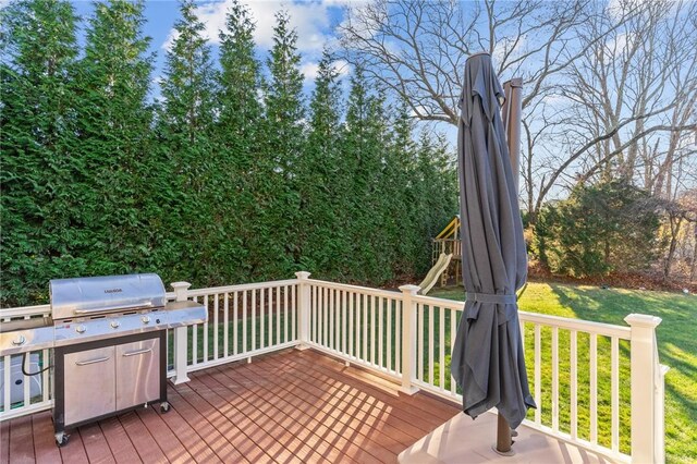 wooden terrace with a yard