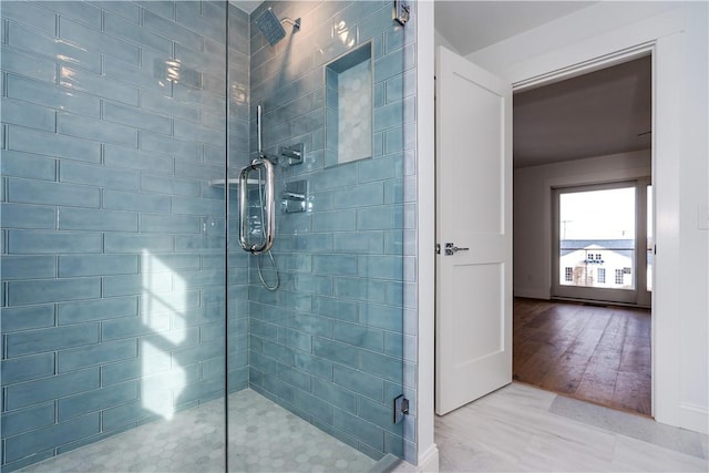 bathroom featuring an enclosed shower