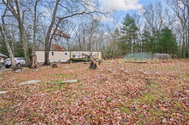 view of yard featuring a deck