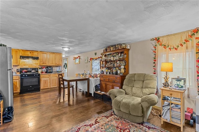 interior space featuring dark hardwood / wood-style floors and a textured ceiling