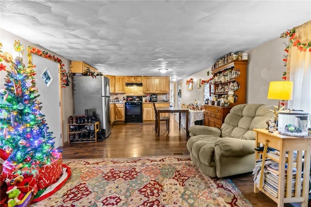 living room featuring bar and dark wood-type flooring