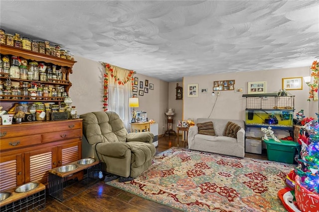 living room featuring bar area, a textured ceiling, and hardwood / wood-style flooring