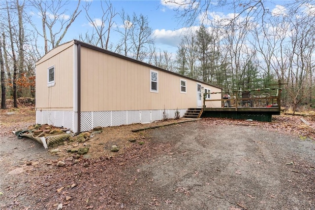 view of property exterior featuring a deck