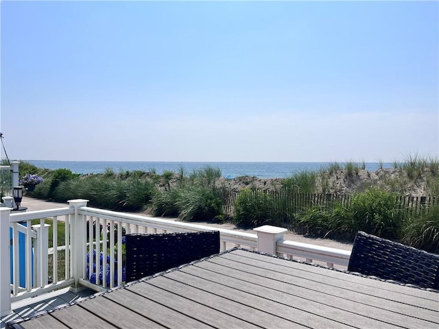 deck featuring a water view