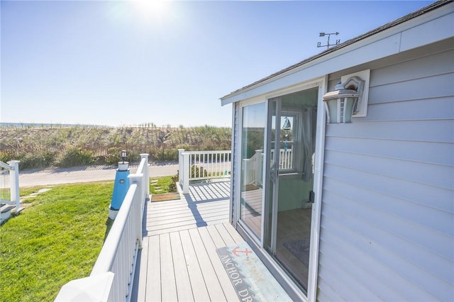 deck featuring a lawn