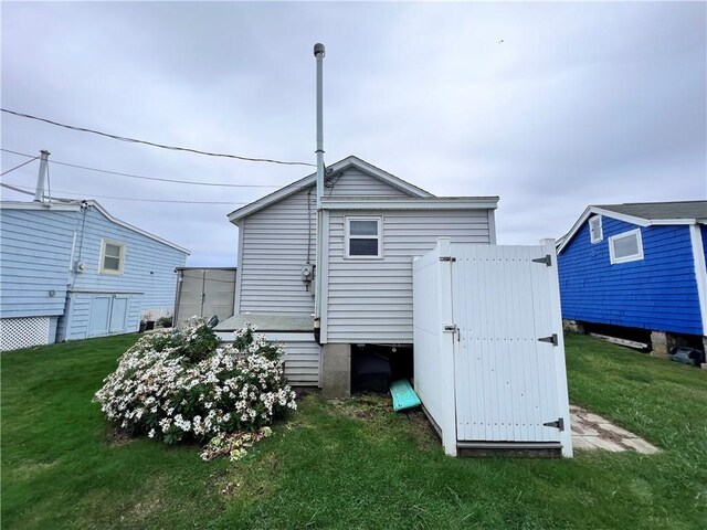 rear view of house with a lawn