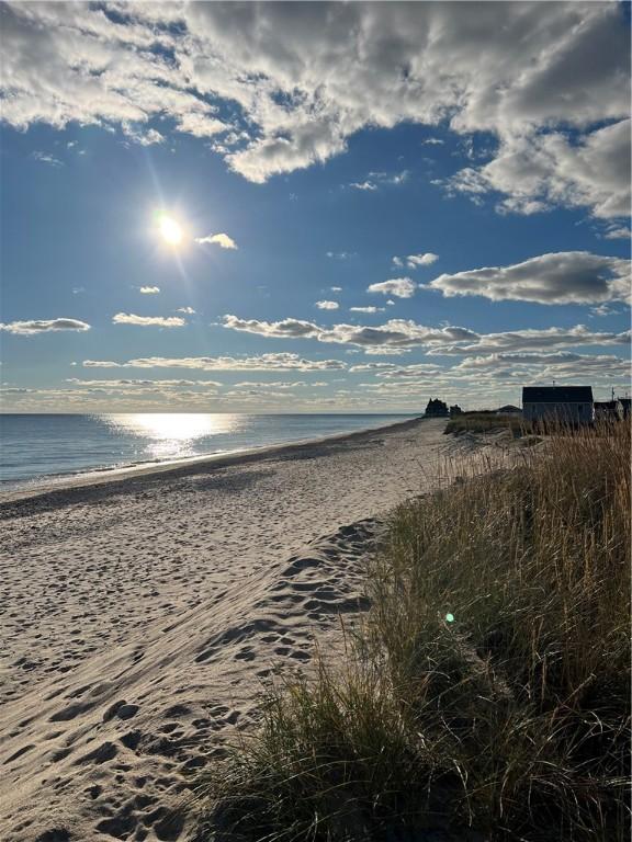 property view of water featuring a beach view