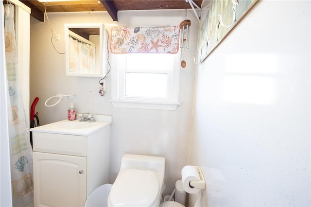 bathroom featuring vanity and toilet